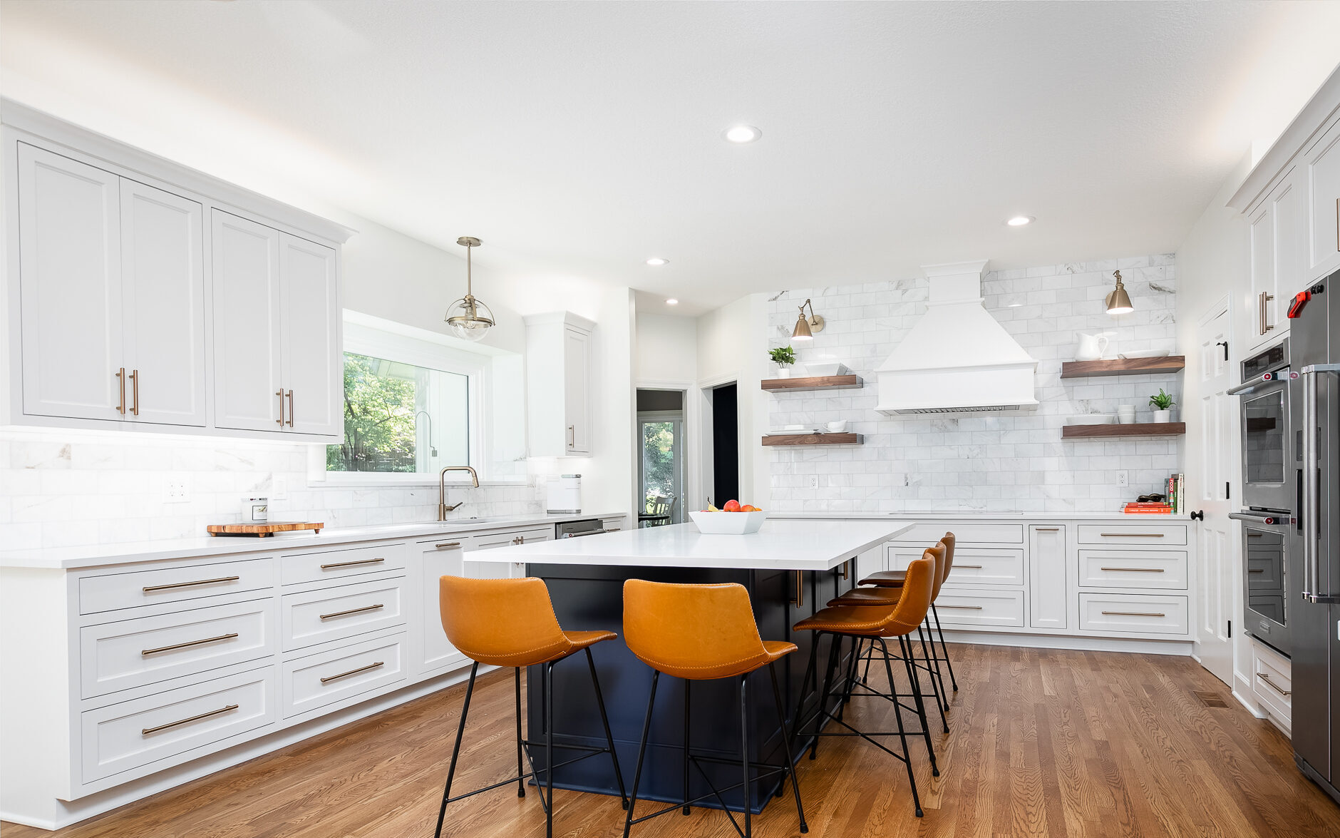 Navigating Your Luxury Kitchen Remodel: A Timeline for High-End Renovations. White inset custom cabinetry, navy blue island, and quartz countertops.